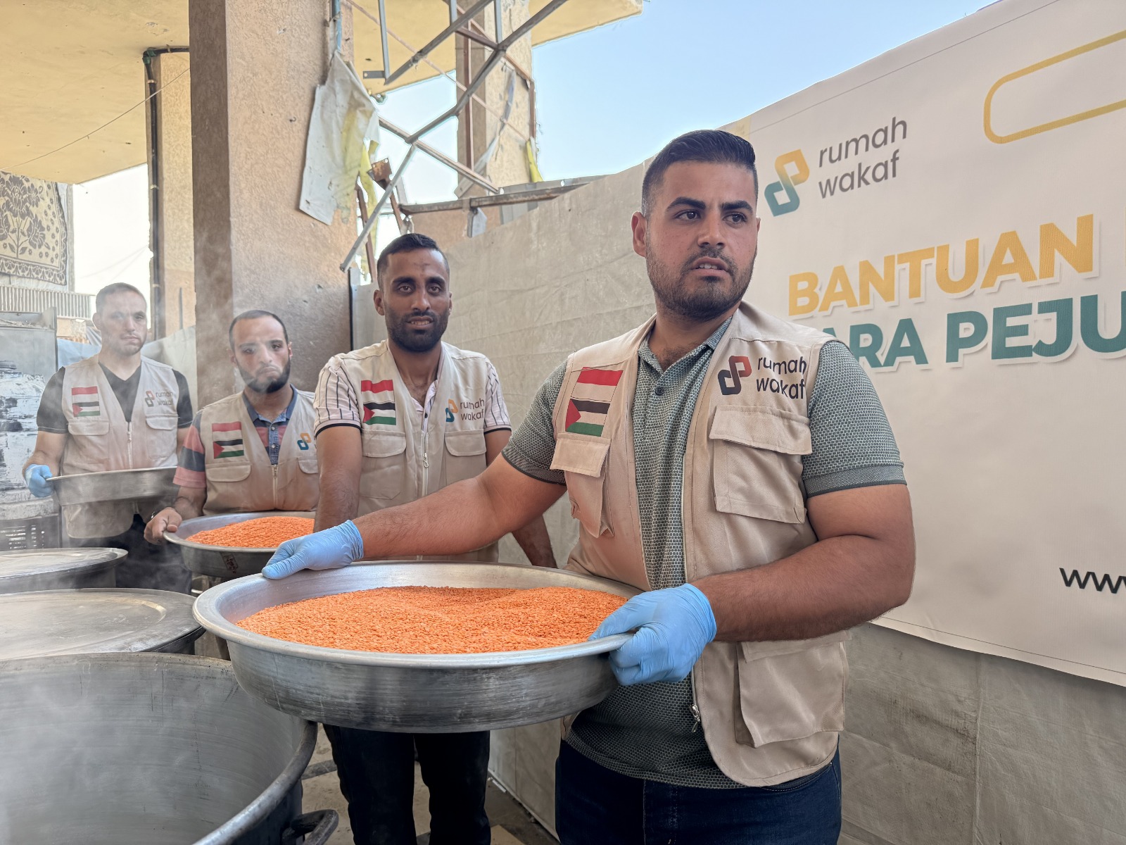 Preparing hot meals for hundreds of families.
